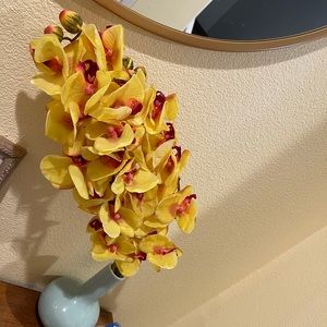 Artificial yellow and pink orchids.
